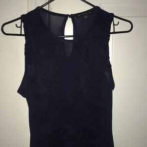 A Haute Monde laced body suit